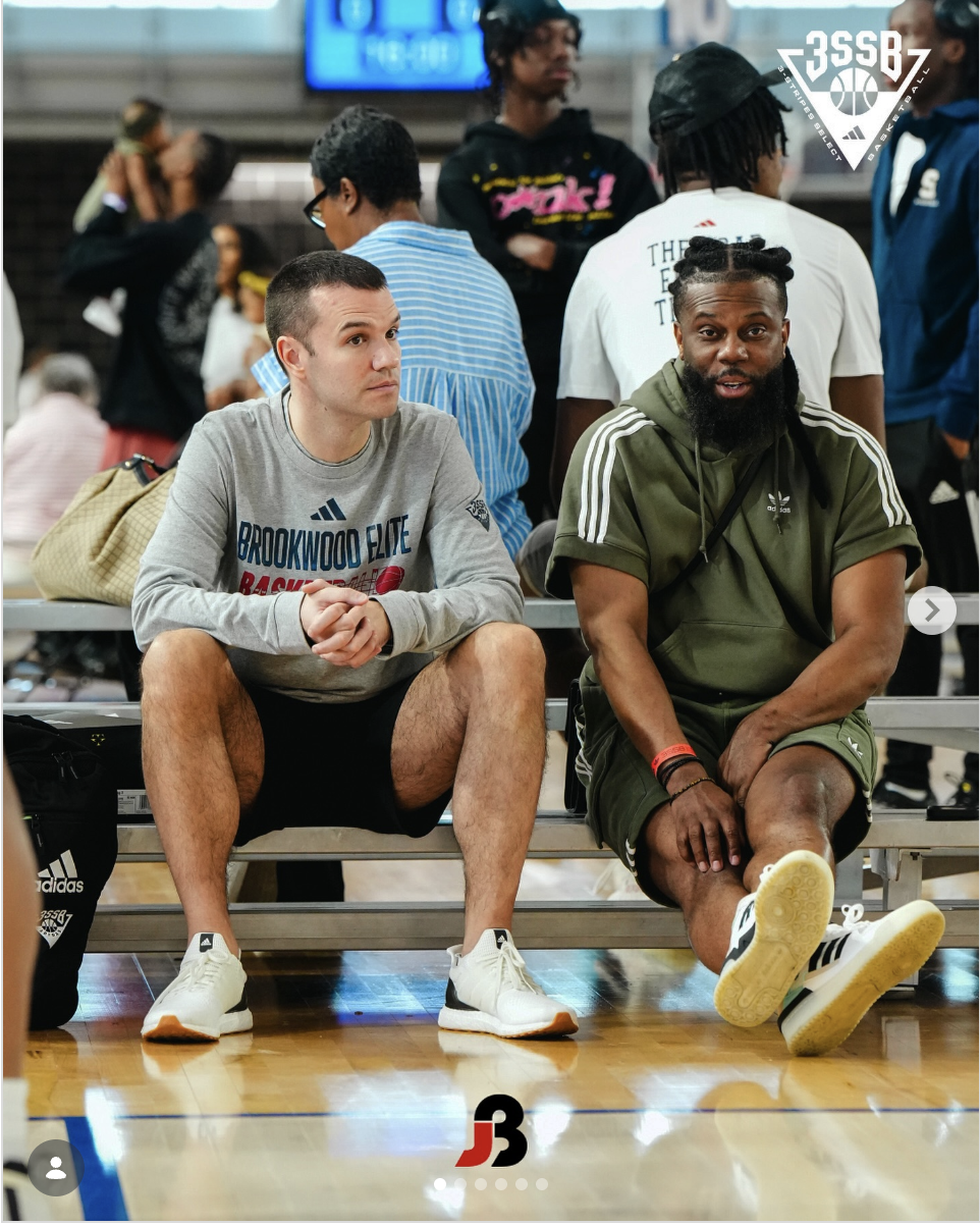 Joey and Nelson courtside at a basketball event